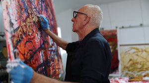 Artist John Berrick working on a large piece in his studio