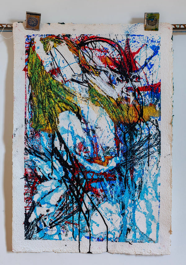 Abstract artwork with colorful splashes on a textured paper background. By John Berrick.